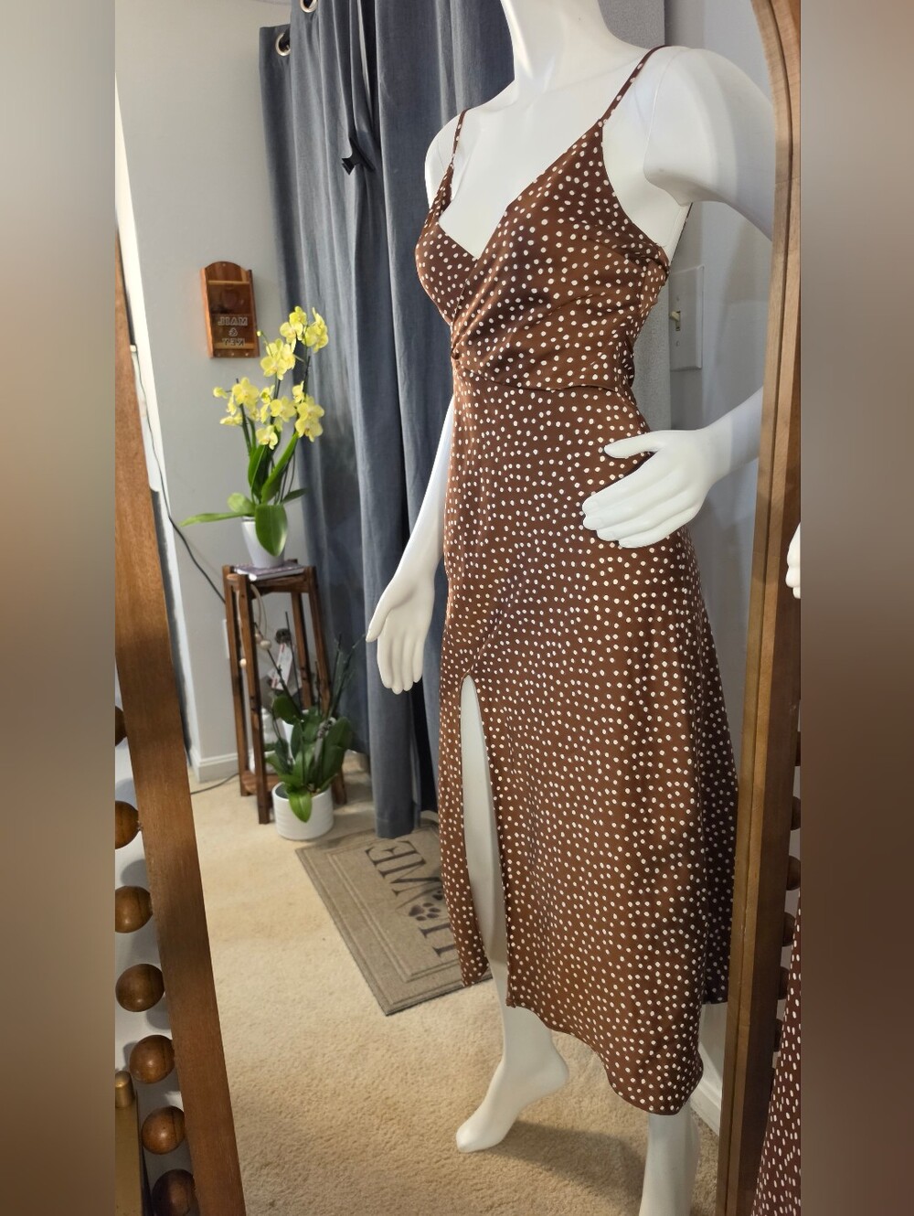 Urban Outfitters brown satin midi dress with a white polka-dot print.
